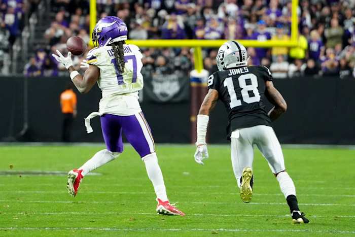 Dec 10, 2023; Minnesota Vikings wide receiver K.J. Osborn (17) makes a catch in front of Raiders cornerback Jack Jones (18). Mandatory Credit: Stephen R. Sylvanie-USA TODAY